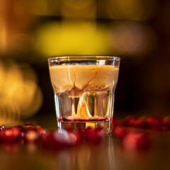 glass with alkohol shot on wooden table square