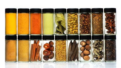 Spices, herbs, spicy and seasoning in glass jars on white background