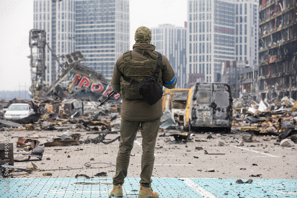 Poster War in Ukraine. Damaged shopping center in Kyiv