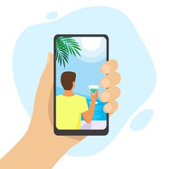 Human hand holding smartphone with tropical picture. Dream about vacations on the seaside