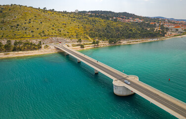 Aerial top view of a long bridge above a sea, island Ciovo in Croatia