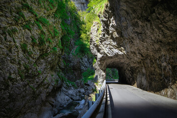 mountain road in the gorge of the mountains near the city in Italy San Pelegrino - 495906610