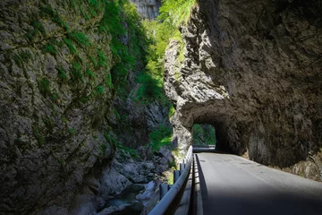 Fototapeten mountain road in the gorge of the mountains near the city in Italy San Pelegrino © makam1969