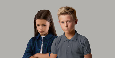 Negative Emotions Concept. Portrait Of Upset Preteen Children Posing Over Grey Background