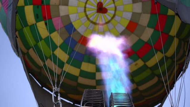 Filling the balloon with gas for take-off in the sky