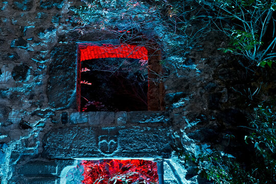 Jamb with bas-relief of the entrance portal of the keep of Santa Barbara Castle. Lodrone, Giudicarie, Trentino, Italy.