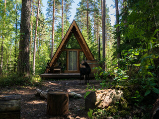 forest house for rest in the summer forest. glamping in the forest