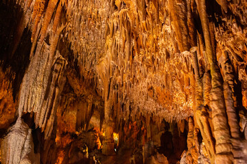 Beautiful view of stalactites and stalagmites in Damlatas underground cave, Alanya-Turkey. Cave dwellings and combinations of features. 