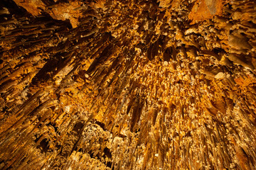 Beautiful view of stalactites and stalagmites in Damlatas underground cave, Alanya-Turkey. Cave dwellings and combinations of features. 