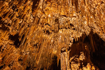Beautiful view of stalactites and stalagmites in Damlatas underground cave, Alanya-Turkey. Cave dwellings and combinations of features. 