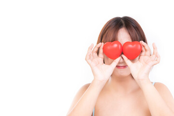 Young woman is holding a red heart for international cardiology day, love, charity, health insurance concept.