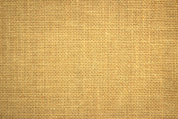 Jute hessian sackcloth canvas woven texture pattern background in light beige cream brown color blank empty