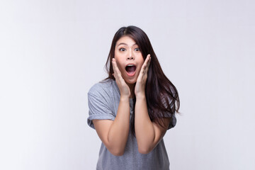 Image of feeling excited, shock, surprise and happy. Young asian woman standing on white background. Female face expressions and emotions body language concept.