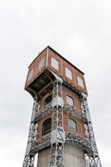 One of the two revitalized towers of the former hard coal mine in Świętochłowice. Towers of KWK Poland. Brick facade and steel support structure.