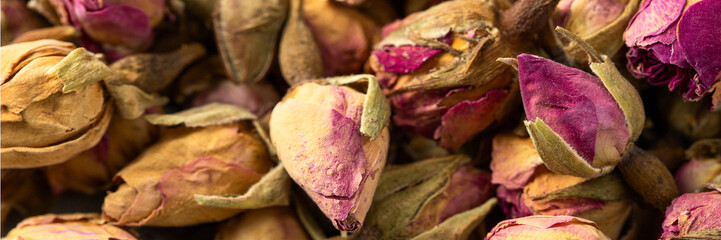 Organic dry Rose Damask petals (Rosa damascena). Macro close up background texture. Top view.