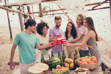 Photo of cheerful best buddies have fun enjoy vacation countryside drink alcohol snack weekend outdoors