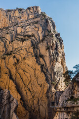 Walkers with helmet enjoying the stunning view of the Rocks in Caminito del Rey, Malaga, Spain.