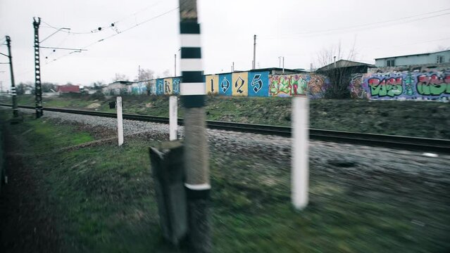 Kharkiv. Ukraine. 2 march 2022. Railway, departure from Kharkiv. Evacuation. Early spring. Fences with graffiti. 