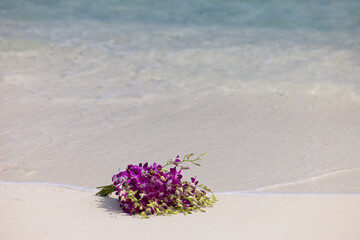 Beautiful bridal bouquet on Maldives beach
