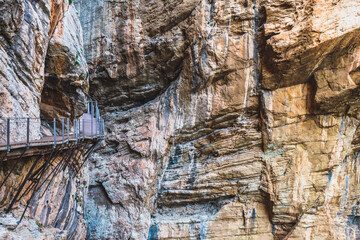 Wood walkway attach to the steep walls of Caminito del Rey in Malaga.