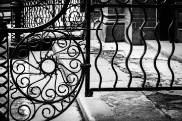 Artistic forged iron railing in black and white