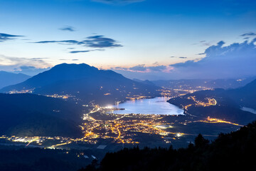 Twilight on the Caldonazzo lake and on the Vigolana plateau. Valsugana, Trento province, Trentino...