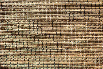 texture of a natural wicker rug made of goutweed and algae.