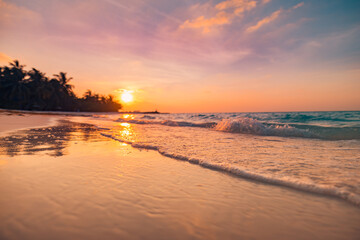 Sunset dramatic sky on sea, tropical desert beach. Dreamy fantasy beach, waves splashing. Warm...