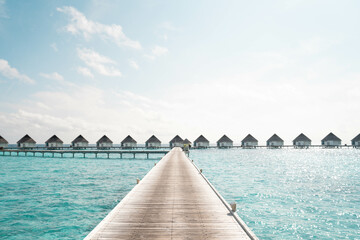 Beautiful Landscape of Over ocean Tropical beach summer resort hotel and spa, Maldives island with sea and sky tranquil for holiday vacation