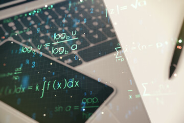 Creative scientific formula hologram on modern laptop background, research concept. Multiexposure