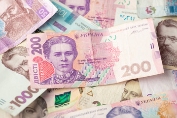 Photo of two hundred hryvnia bill and ukrainian banknotes