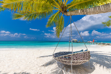 Tropical beach paradise as summer landscape with beach swing or hammock and white sand, calm sea for serene beach. Luxury beach scene vacation summer holiday. Exotic island nature travel destination
