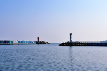 Fototapeta na wymiar light house on the pier of sea