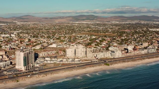 Beachfront Cityscape With Coastal Road At Blouberg Beach In Cape Town, South Africa. Aerial Wide Shot