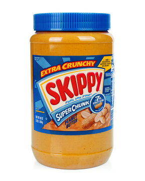 Jar of peanut butter Extra Crunchy Skippy Super Chunk, on white background