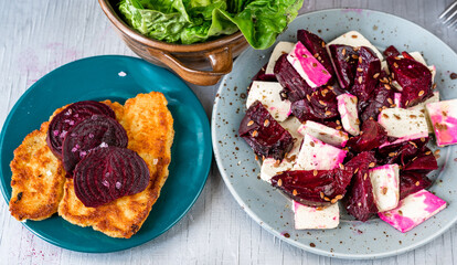Fried breaded celery and red beetroot, tofu salad with red beetroot and flaxseed, lettuce salad.