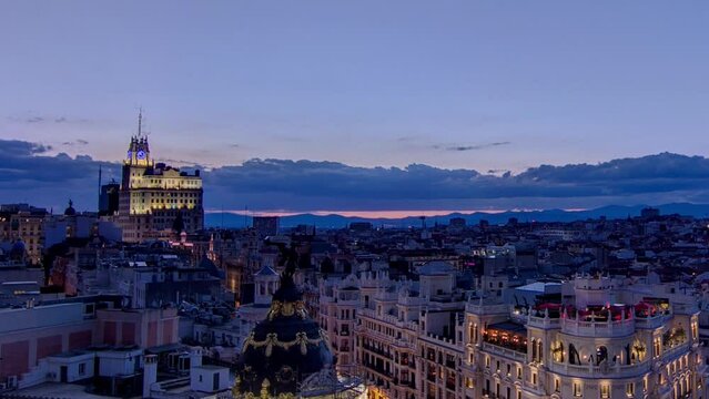 Panoramic aerial view of Gran Via day to night timelapse, Skyline Old Town Cityscape, Metropolis Building, capital of Spain