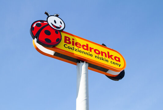 Biedronka supermarket shop logo sign. Retail chain of discount shops in Poland. Convenience grocery store, Polish shopping center. Signboard with brand logotype on March 27, 2022 in Krakow, Poland.