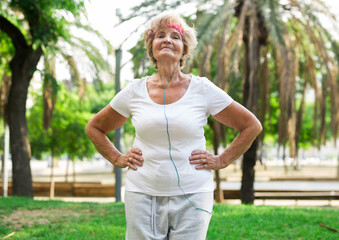 Mature woman training in park