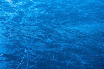Ice surface in sports arena for figure skating or hockey. Ice background and ice texture is cut...
