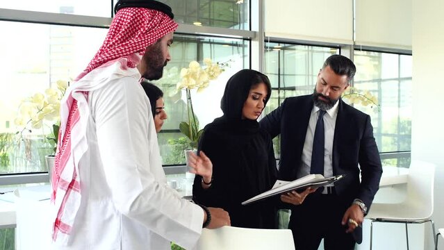 Multiethnic corporate business team meeting in the office for a strategic marketing plan - Office workers, entrepreneurs, and company employees at work in a multinational company