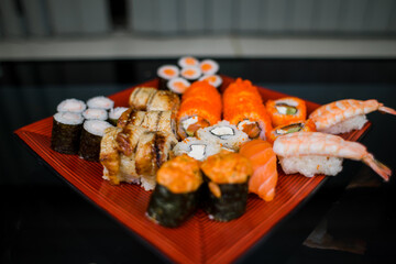 a set of sushi rolls from fish and seafood a set of different videos japanese cuisine delivery
