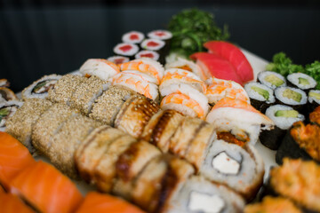 set of rolls set sushi with avocado shrimp salmon and eel