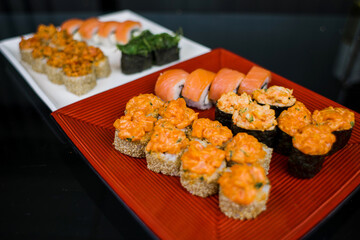 a set of sushi rolls from fish and seafood a set of different videos japanese cuisine delivery