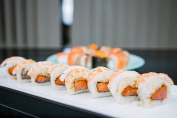 a Japanese roll with shrimp and salmon with white rice
