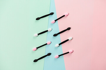 Set of applicators for applying shadows on multicolored background. Beauty eye. Womens cosmetics. Viewing depth.