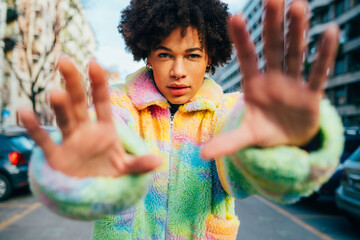 Young black woman outdoor city gesturing stop showing palm hands