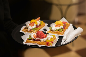 belgian waffels with fruit and whiped cream