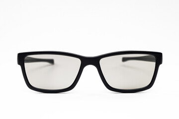 Classic black-framed glasses on a white background. Tinted eyeglasses. Not an isolate.