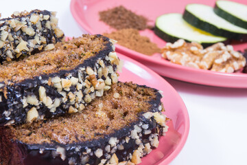 Pastry made of zucchini with nuts and raisin. Delicious dessert. White background